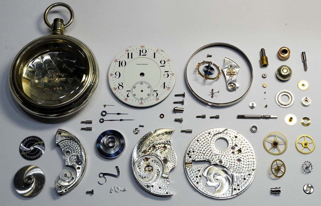 Display of pocket watch completely disassembled
